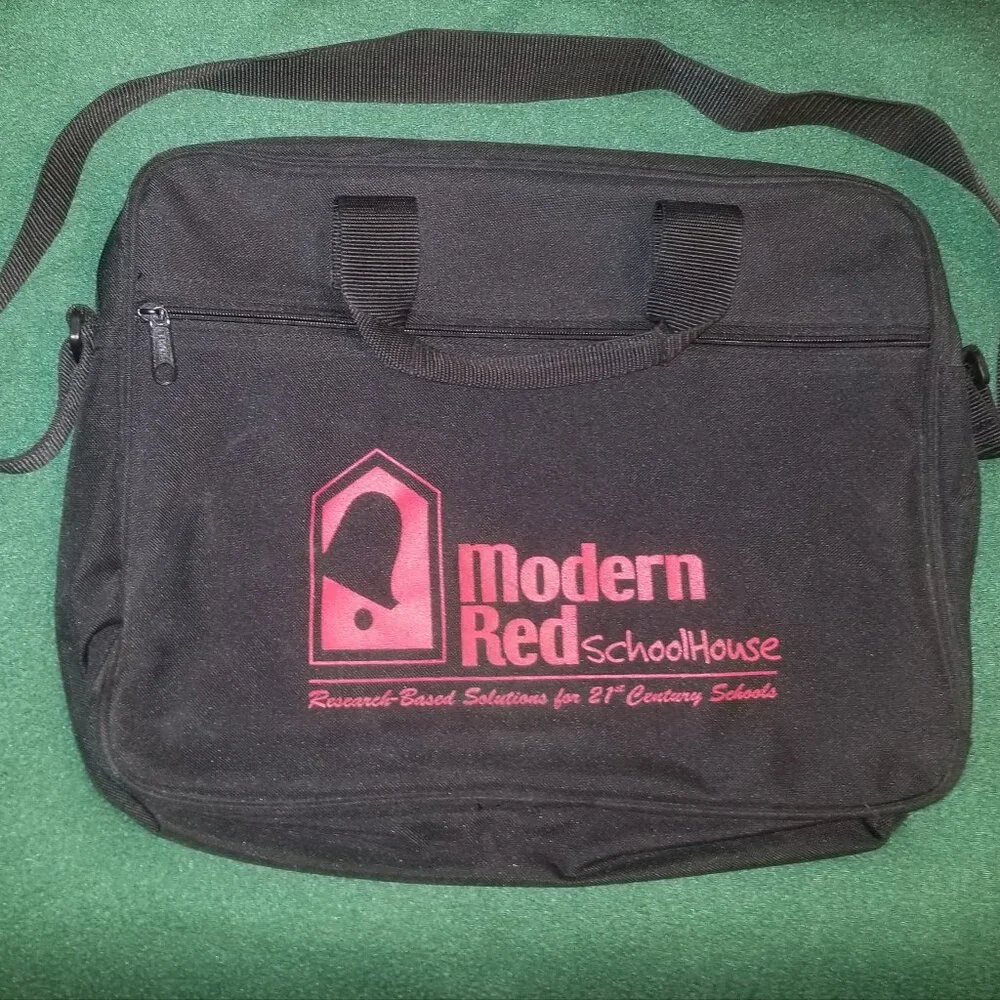 large black bag with straps, and ink-stained interior